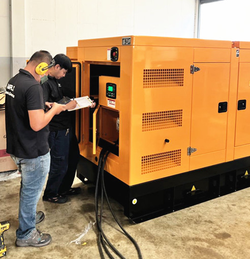 Technicians inspecting a WALT diesel generator