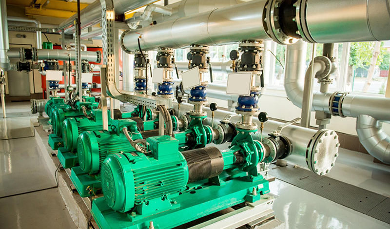 Large industrial electric motor and pump system in factory environment