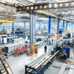 Large industrial manufacturing facility with heavy machinery and production lines