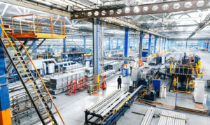Large industrial manufacturing facility with heavy machinery and production lines