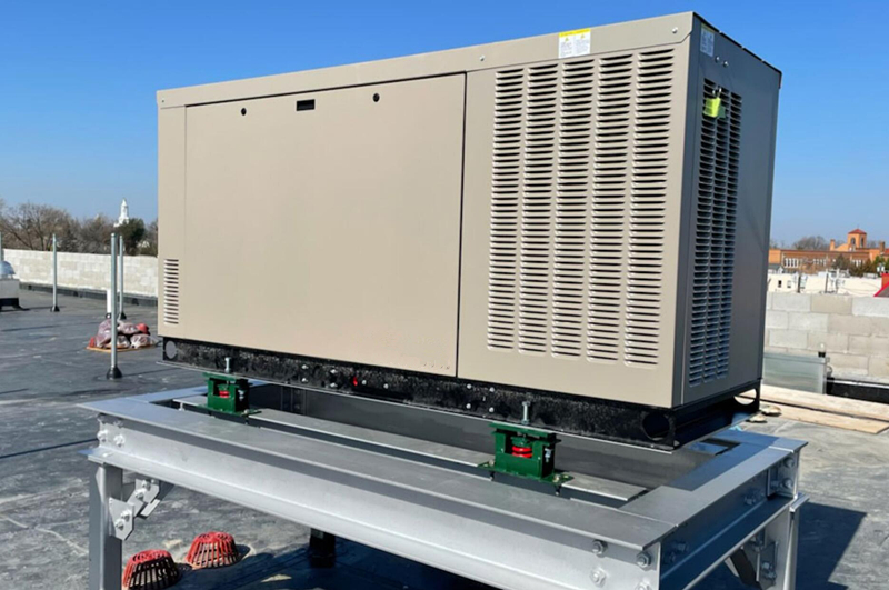 Silent standby diesel generator installed outside a commercial building with proper clearance