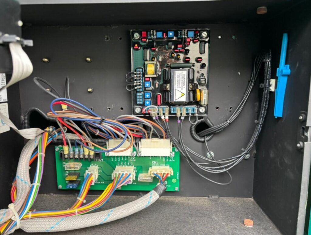 Automatic voltage regulator AVR installed on generator alternator