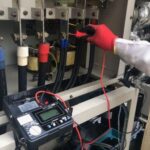 Checking three phase diesel generator voltage during load testing